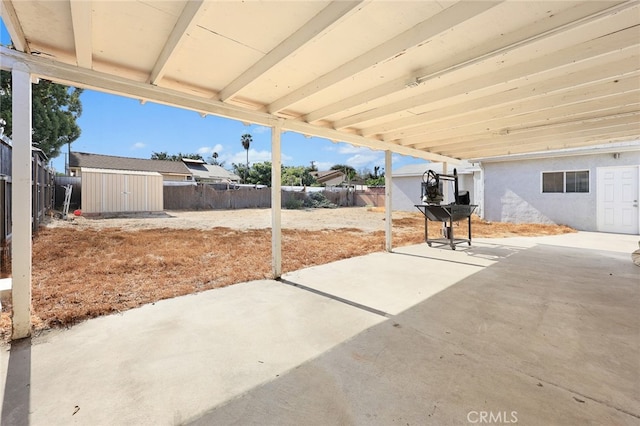 view of patio / terrace featuring a storage shed