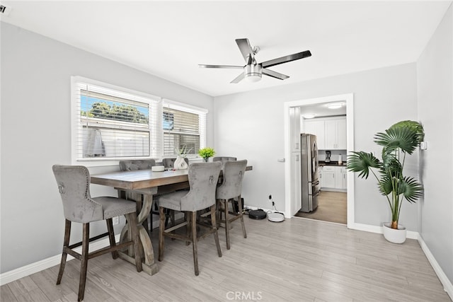 dining room featuring ceiling fan and light hardwood / wood-style flooring