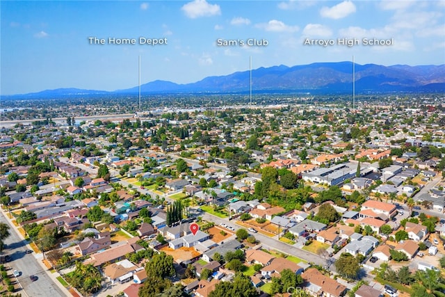 birds eye view of property featuring a mountain view