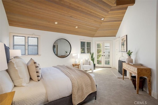 carpeted bedroom with lofted ceiling, wood ceiling, and french doors