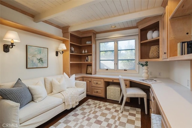 office with beamed ceiling, built in desk, light hardwood / wood-style floors, and wooden ceiling