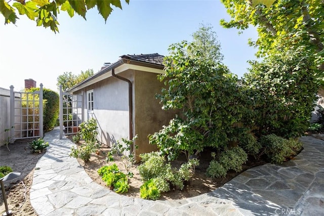 view of side of property with a patio