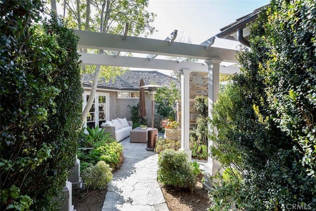 view of patio / terrace featuring outdoor lounge area and a pergola