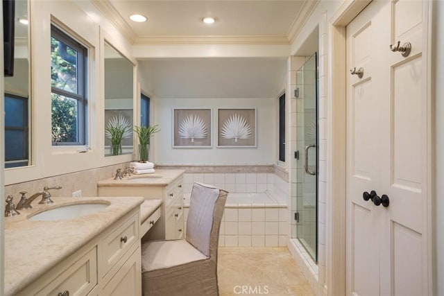 bathroom with tile patterned flooring, vanity, ornamental molding, and shower with separate bathtub