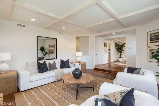 living room featuring beamed ceiling, wood-type flooring, crown molding, and coffered ceiling