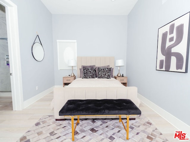 bedroom with light hardwood / wood-style floors