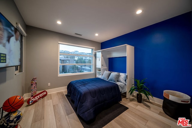 bedroom featuring light hardwood / wood-style floors