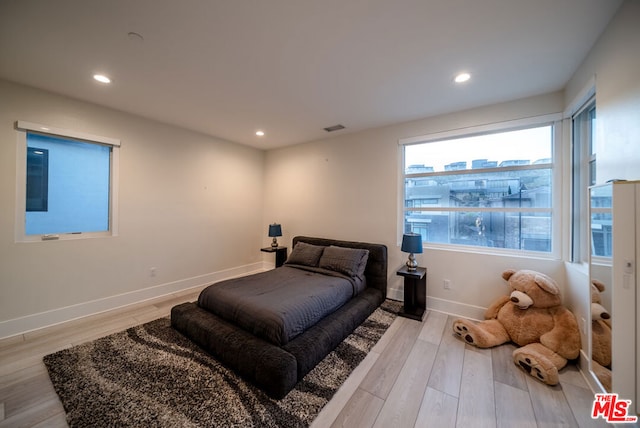 bedroom with light wood-type flooring