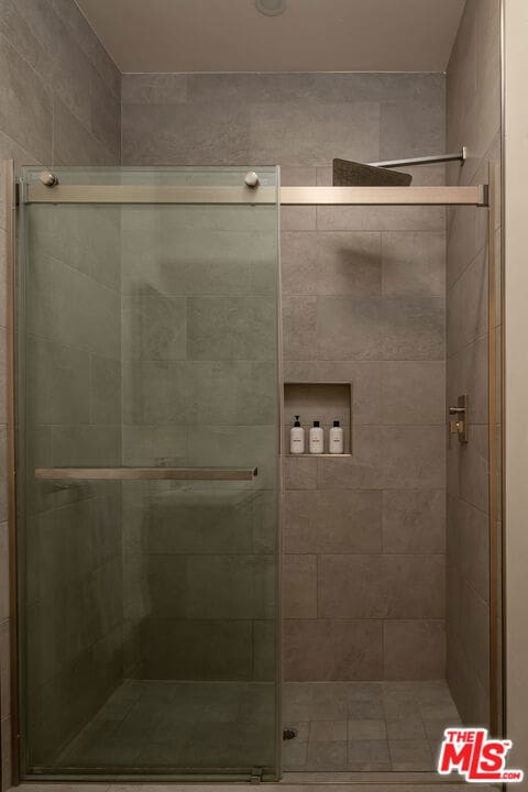 bathroom featuring an enclosed shower