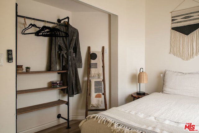 bedroom with hardwood / wood-style floors