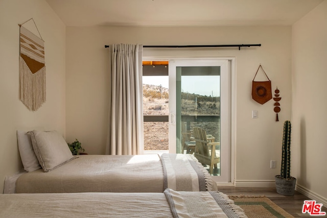 bedroom with hardwood / wood-style floors