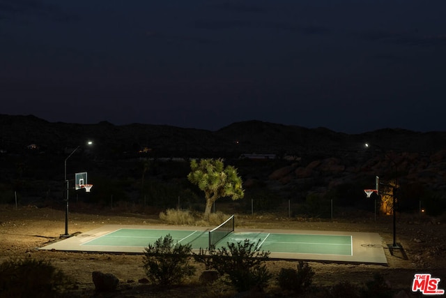 view of basketball court featuring a mountain view