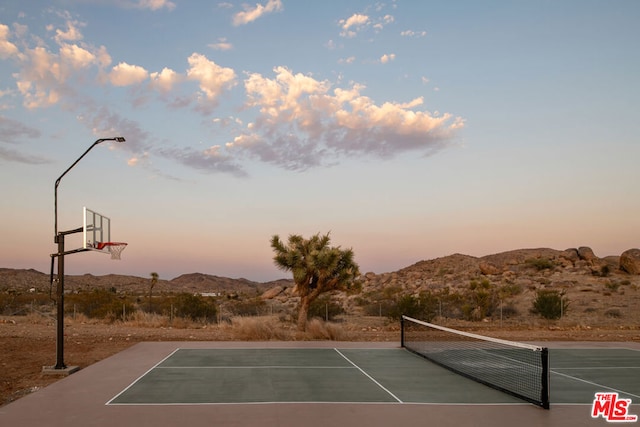 view of sport court with basketball court and a mountain view