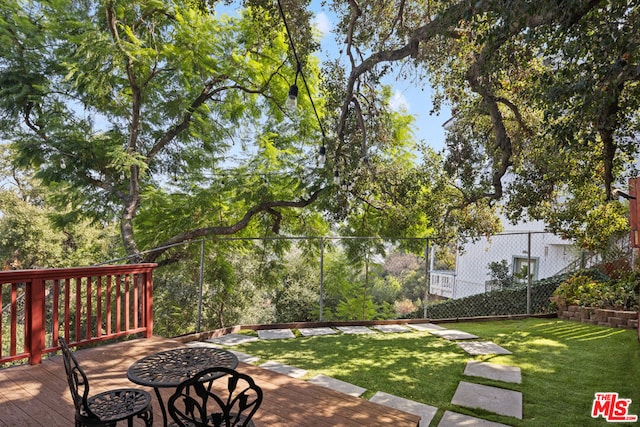 view of yard with a wooden deck