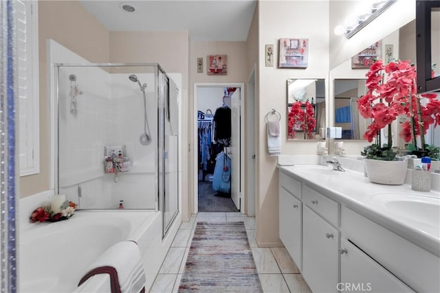 bathroom with separate shower and tub, tile patterned floors, and vanity