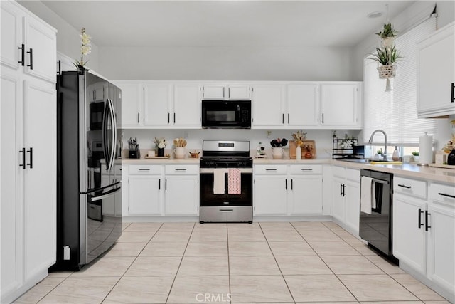 kitchen with sink, white cabinets, and black appliances