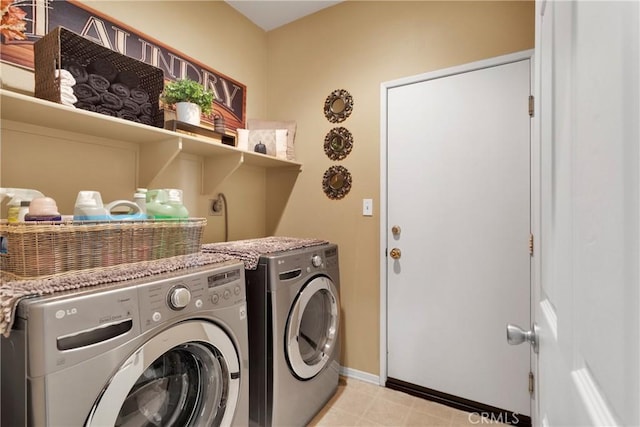 clothes washing area featuring washer and clothes dryer