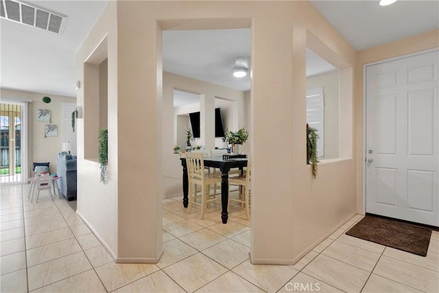 entrance foyer with light tile patterned floors