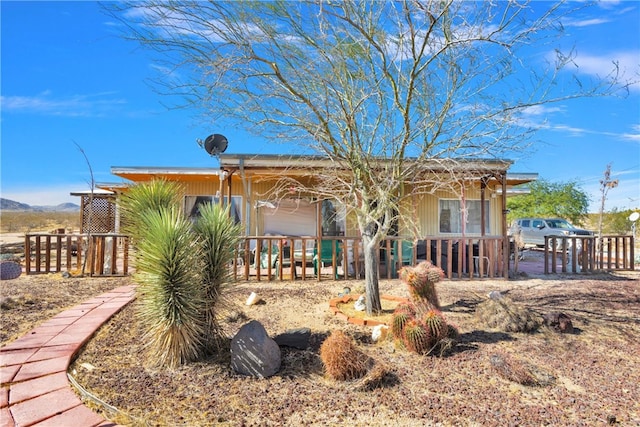 back of property with a mountain view