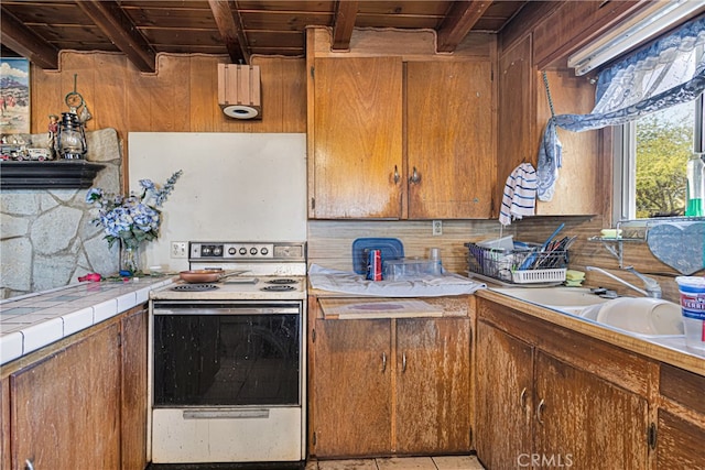 kitchen featuring white range with electric stovetop, beamed ceiling, wooden ceiling, and sink