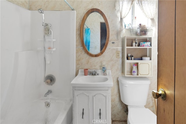 full bathroom featuring vanity, shower / bath combination, and toilet