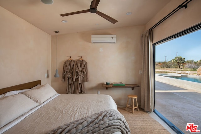 bedroom with an AC wall unit, vaulted ceiling, access to exterior, and ceiling fan