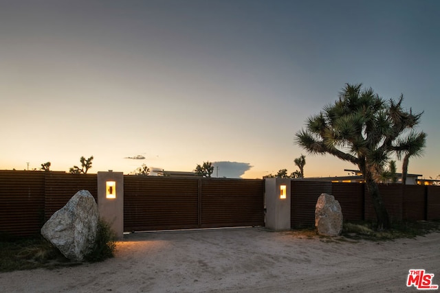 view of gate at dusk