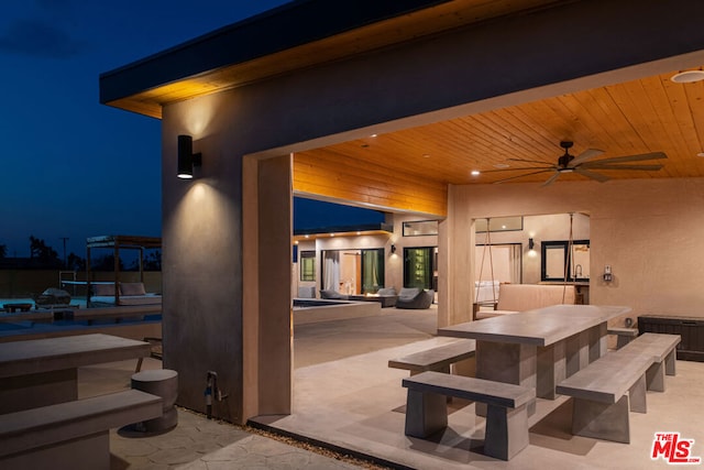 patio at night with ceiling fan