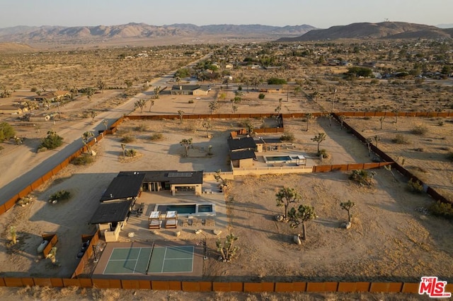 birds eye view of property featuring a mountain view