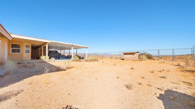 view of yard with a carport