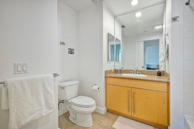 bathroom featuring vanity, toilet, and tile patterned flooring