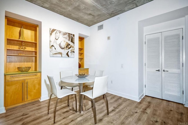 dining space featuring light hardwood / wood-style floors