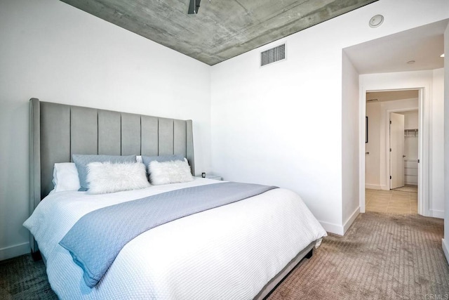 bedroom featuring light colored carpet