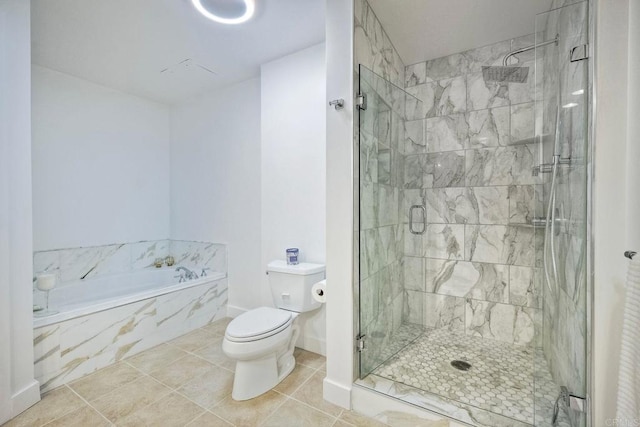 bathroom featuring tile patterned flooring, toilet, and shower with separate bathtub