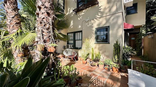 view of side of home with a patio