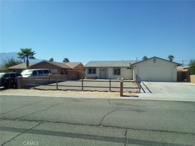 single story home featuring a garage