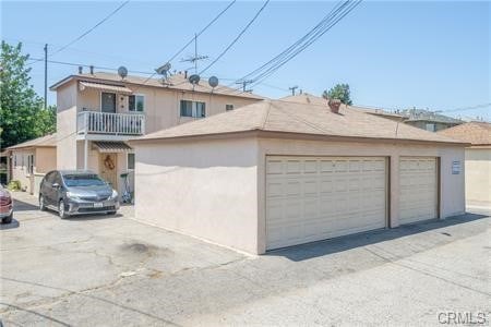 exterior space with a balcony and a garage