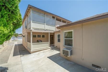 view of side of property featuring a patio area