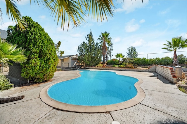 view of swimming pool featuring a patio