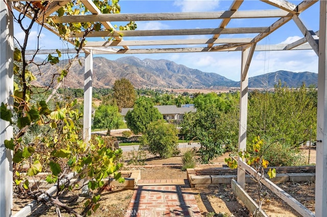 view of patio featuring a mountain view and a pergola