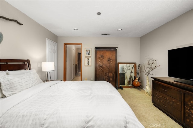 bedroom featuring light carpet