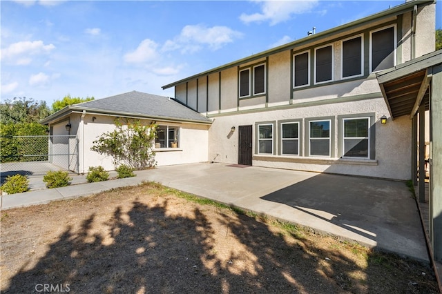 back of property featuring a patio