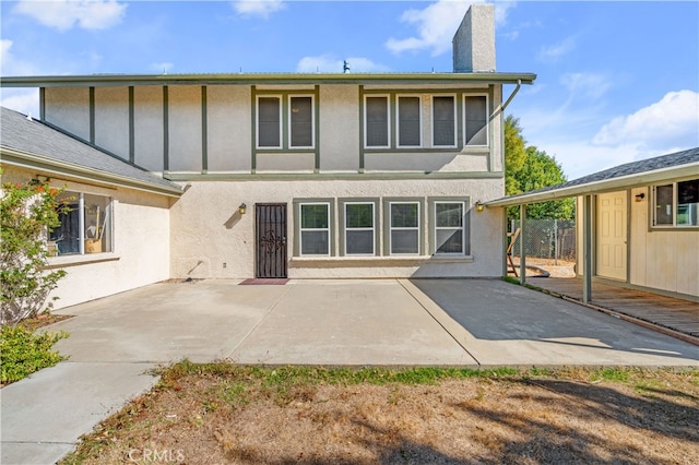 rear view of house featuring a patio area