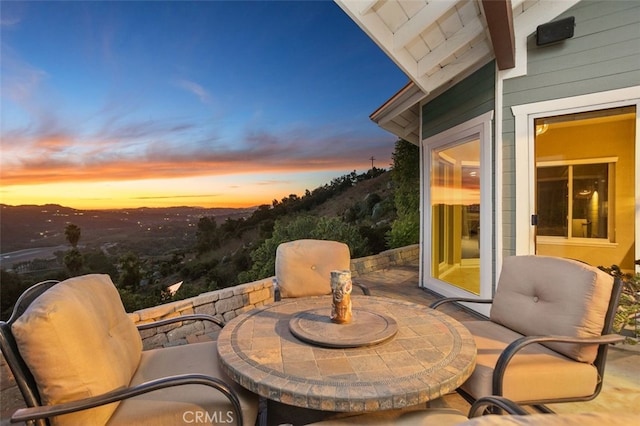 view of patio terrace at dusk