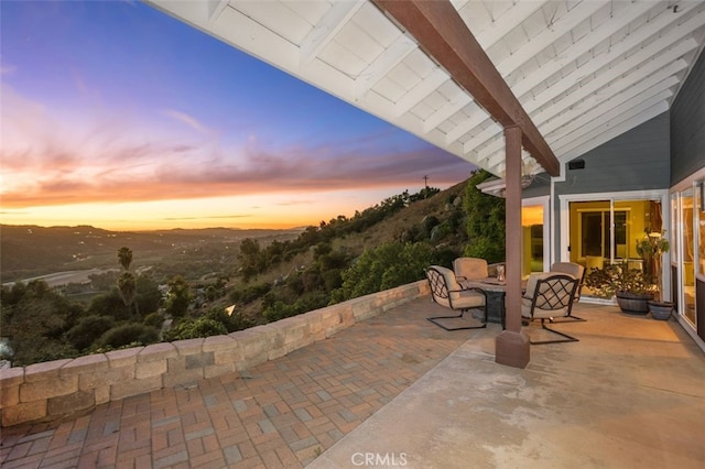 view of patio terrace at dusk