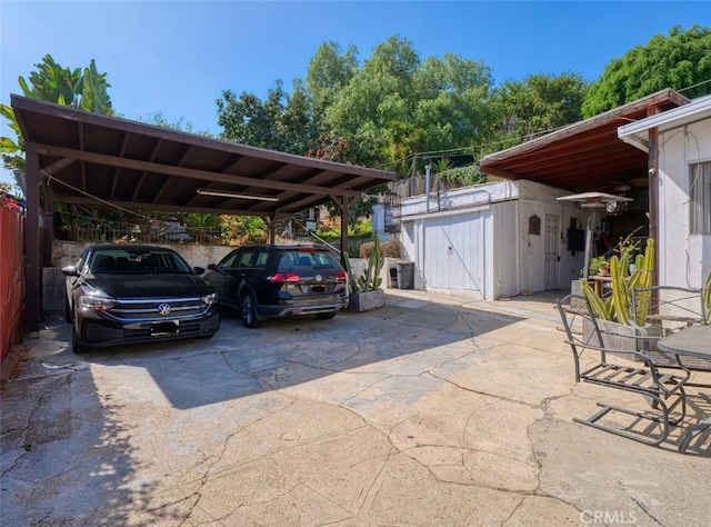 view of vehicle parking featuring a carport