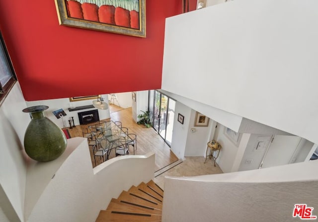 stairway featuring hardwood / wood-style floors