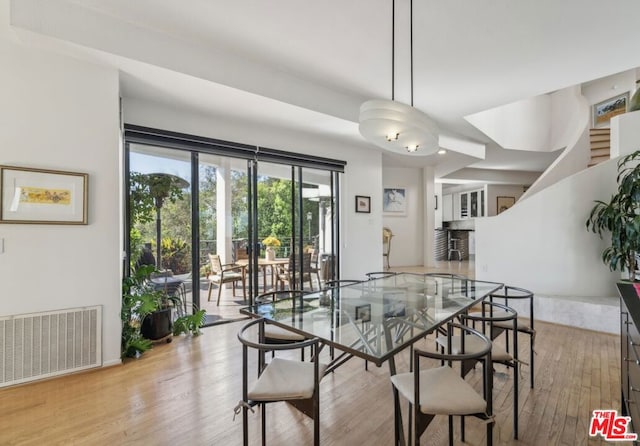 dining area with light hardwood / wood-style floors