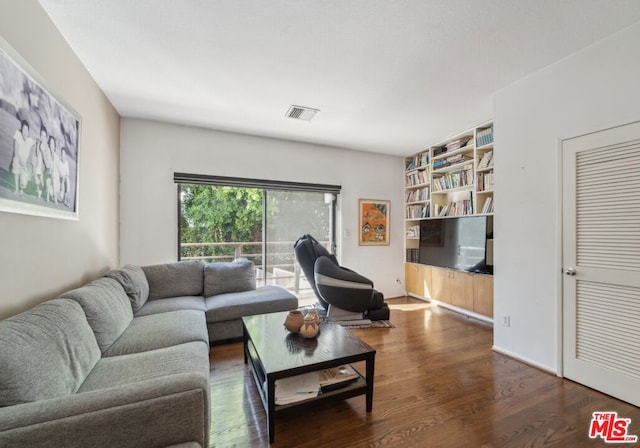 living room with dark hardwood / wood-style floors