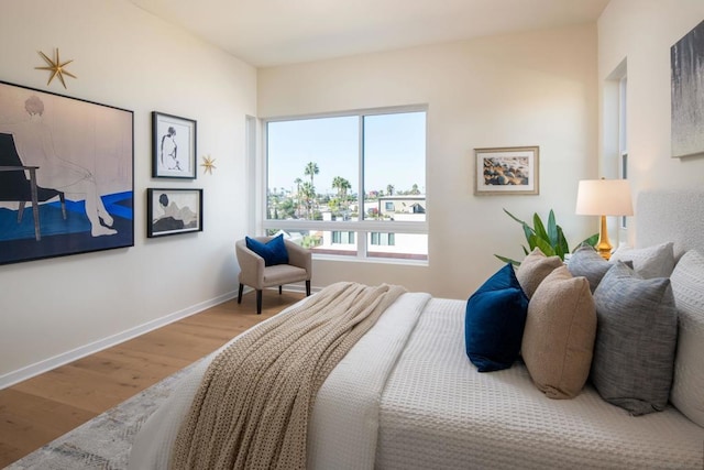 bedroom with hardwood / wood-style floors